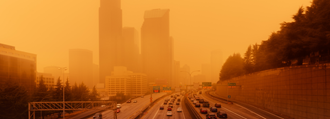 Seattle skyline in a smoky, orange haze