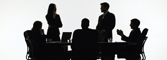 Silhouette of people in a business meeting